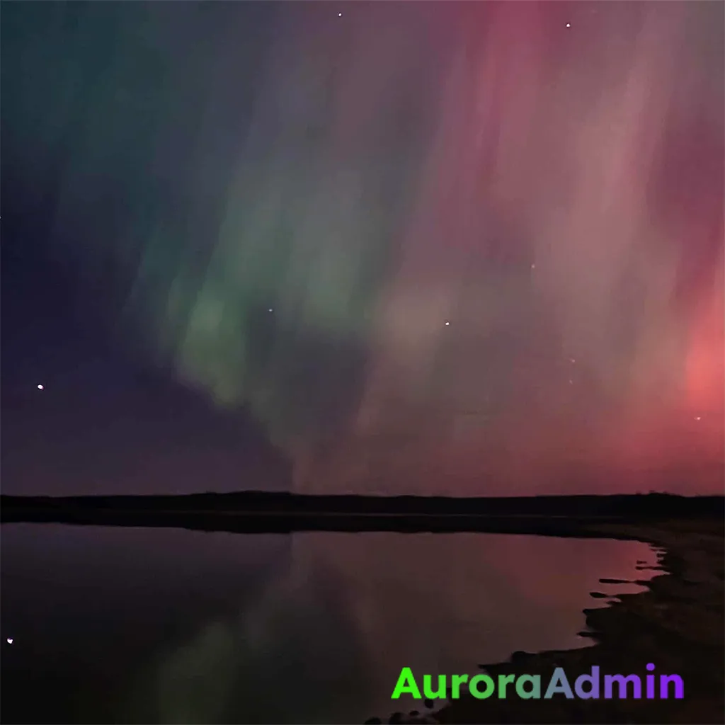 A mobile phone photo of the aurora borealis in Miquelon Lake Provincial Park, Alberta, Canada.